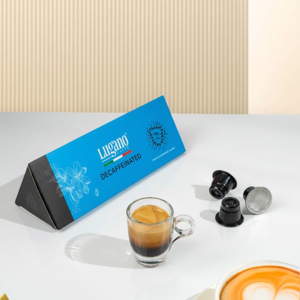Lugano Caffè Decaffeinated Espresso Capsule Triangular Pack 10 Pcs wih an espresso cup in a set