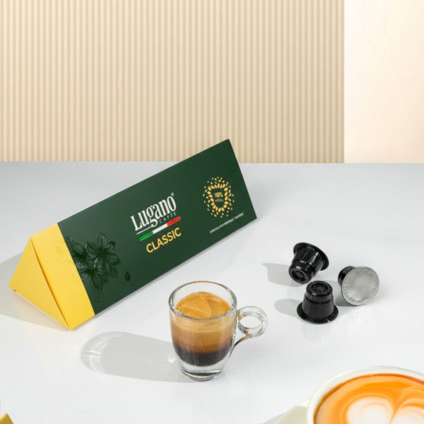 Lugano Caffè Classic Espresso Capsule Triangular Pack 10 Pcs wih an espresso cup in a set