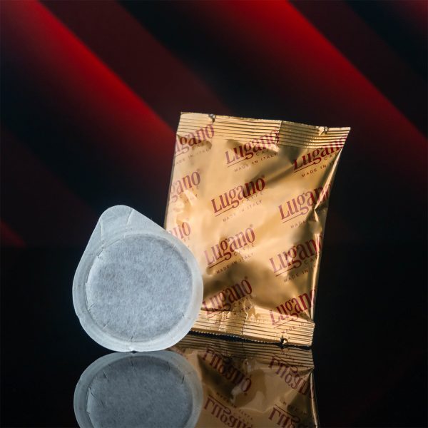 Lugano Caffè Strong Espresso Pod and its Aluminum Foil in a Studio Set