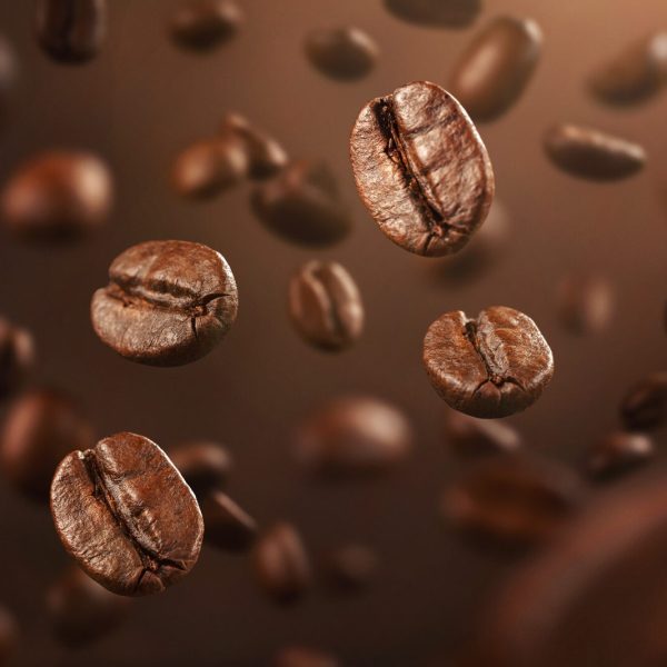 Roasted coffee beans falling down